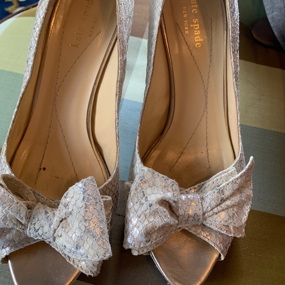 Kate soade silver bow shoes. Worn about 5 times. Mark’s on bottom but great conf